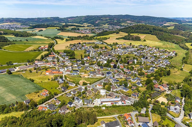 Aerial view, view of Langenholthausen, Goldbäckerei Grote GmbH, Sunderner Straße, St. Johannes Kirche Langenholthausen, Balve, Sauerland, North Rhine-Westphalia, Germany, place of worship, DE, Europe, commercial enterprises, commercial area, commercial location, commercial use, religious community, place of worship, Grote bakery, church, parish, denomination, aerial view, aerial photography, aerial photography, overview, bird's-eye view, birds-eyes view, overview, Langenholthausen