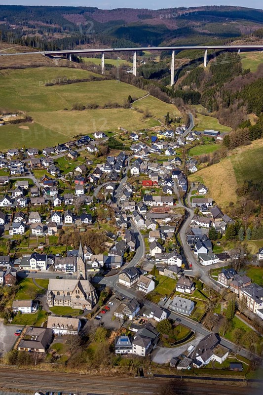 Aerial view, aerial view Nuttlar, viaduct Nuttlar, motorway A46, Bestwig, North Rhine-Westphalia, Germany, DE, Europe, religious community, place of worship, property tax, hilly landscape, real estate, church, parish, denomination, aerial view, aerial photography, aerial photography, religion, overview, bird's eye view, forest, meadows and fields, living and life, residential area, residential buildings, birds-eyes view, catholic church St. Anna Nuttlar, overview