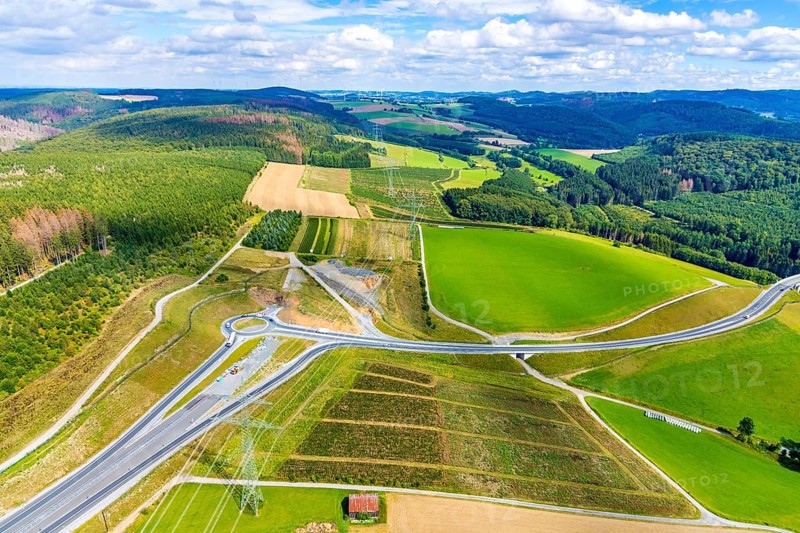 Aerial view, motorway A46, Nuttlar junction B480n, view towards Brilon, further construction of the motorway A46, hilly landscape, Bestwig, North Rhine-Westphalia, Germany, motorway A46 extension, construction work, construction area, construction site, construction measure, construction project, construction site, federal road B480n, DE, Europe, roundabout, aerial view, aerial photography, aerial photography, new construction, Nuttlar, Sauerland, overview, bird's eye view, forest area, meadows and fields, birds-eyes view, overview