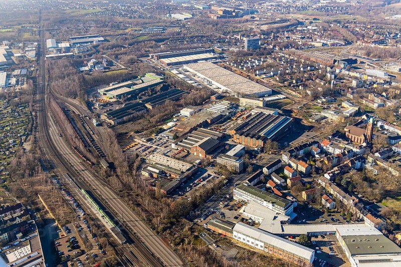 Aerial view, Heintzmann-Werke, Bessemer Straße, Kruppwerke, Bochum, Ruhr area, North Rhine-Westphalia, Germany, railway tracks, railway station, Bessemer Straße, Bochum-Ehrenfeld, DE, DSV Stuttgart GmbH LKW Spedition, Deutsche Bahn AG, commercial space, commercial area, commercial use, Heintzmann Holding GmbH, industrial plants, industrial site, aerial view, aerial photography, aerial photography, production plants, production halls, S-Bahn, S-Bahn station, overview, bird's-eye view, birds-eyes view, overview
