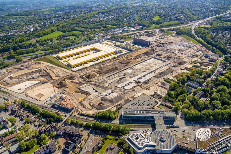 Aerial view, new construction DHL logistics parcel centre, former Opel site, former Opel administration building, Laer district, Bochum, Ruhr area, North Rhine-Westphalia, Germany, expansion areas, A448 motorway, construction, construction area, construction site, construction project, construction site, DE, DHL, DHL logistics, DHL parcel centre, earthworks, Renewal, development, Europe, distant view, Mark 51/7 industrial estate, capacity requirements, logistics, aerial view, aerial photography, aerial photography, new build, Opel site, Opelring 1, overview, bird's-eye view, growth, becoming and growing, birds-eyes view, former Opel site with old administration building, overview