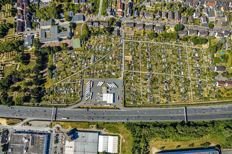 Aerial view, Shell petrol station, Vietingstraße, truck parking, motorway A40, allotment garden site Centrum Morgensonne, KGV am Dückerweg, Bochum-Wattenscheid, Ruhr area, North Rhine-Westphalia, Germany, education, educational institution, DE, Europe, shapes and colours, community garden, freight transport, freight transport, KGV, allotment garden, allotment garden site, allotment garden association, allotment gardener association, educational institute, aerial photography, aerial photography, aerial photography, car parks, passenger traffic, Pestalozzi School, allotment garden, school, road traffic, petrol station, overview, traffic volume, bird's-eye view, overview, nature and road traffic, traffic infrastructure, Ruhr Expressway