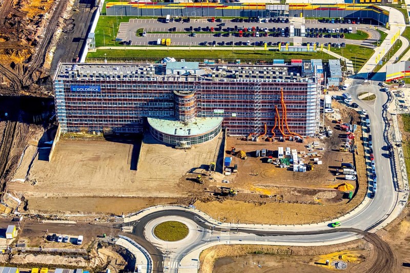 Aerial view, MARK 51Â°7 industrial estate, former Opel site with old administration building, Laer, Bochum, Ruhr area, North Rhine-Westphalia, Germany, expansion areas, construction, construction area, construction site, construction project, construction site, DEU, monument protection, earthworks, renewal, development, Europe, Mark 51/7 industrial estate, capacity requirements, roundabout, logistics, aerial view, aerial photography, aerial photography, new build, Opel site, Opelring 1, overview, administration, bird's-eye view, growth, becoming and growing, birds-eyes view, overview