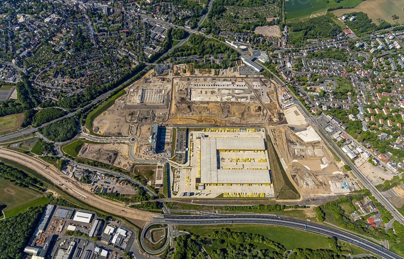 Aerial view, new construction DHL logistics parcel centre, former Opel site, former Opel administration building, Laer district, Bochum, Ruhr area, North Rhine-Westphalia, Germany, expansion areas, A448 motorway, construction, construction area, construction site, construction project, construction site, DE, DHL, DHL logistics, DHL parcel centre, earthworks, Renewal, development, Europe, distant view, Mark 51/7 industrial estate, capacity requirements, logistics, aerial view, aerial photography, aerial photography, new build, Opel site, Opelring 1, overview, bird's-eye view, growth, becoming and growing, birds-eyes view, former Opel site with old administration building, overview