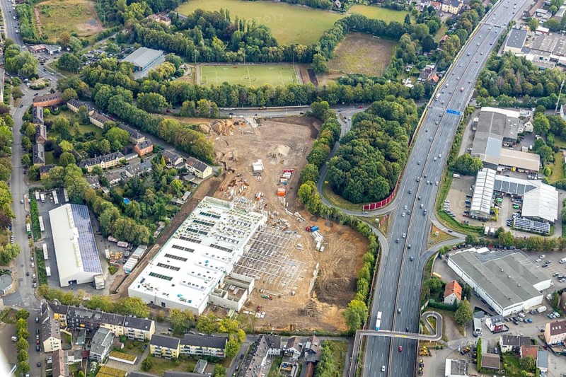 Aerial view, Berliner Straße, planned DIY store with garden centre, motorway A40, junction Wattenscheid-West, sports centre Wattenscheid-West Berliner Straße, Leithe, Bochum, Ruhr area, North Rhine-Westphalia, Germany, construction work, construction area, building site, building plots, construction project, construction site, Bochum-Wattenscheid, DE, Europe, football pitch, football stadium, football club, Klaus-Steilmann-Platz, aerial view, aerial photography, aerial photography, new construction, sports, sports facilities, sports community 09 Wattenscheid, sports field, sports facility, Wattenscheid district, overview, bird's-eye view, Wattenscheid, birds-eyes view, planned construction market, overview