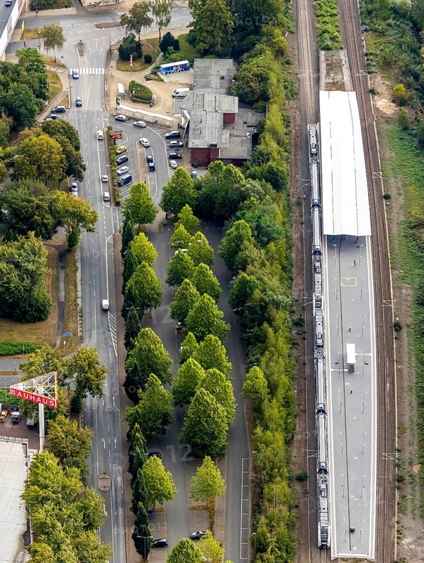 Aerial view, Wattenscheid railway station, motorway exit Bochum-Wattenscheid, Westenfeld, Bochum, Ruhr area, North Rhine-Westphalia, Germany, motorway A40, railway tracks, railway station, station forecourt, Bochum-Wattenscheid, DE, Deutsche Bahn AG, Europe, green trees, main station, aerial view, aerial photography, aerial photography, Wattenscheid district, overview, bird's eye view, Wattenscheid, birds-eyes view, overview