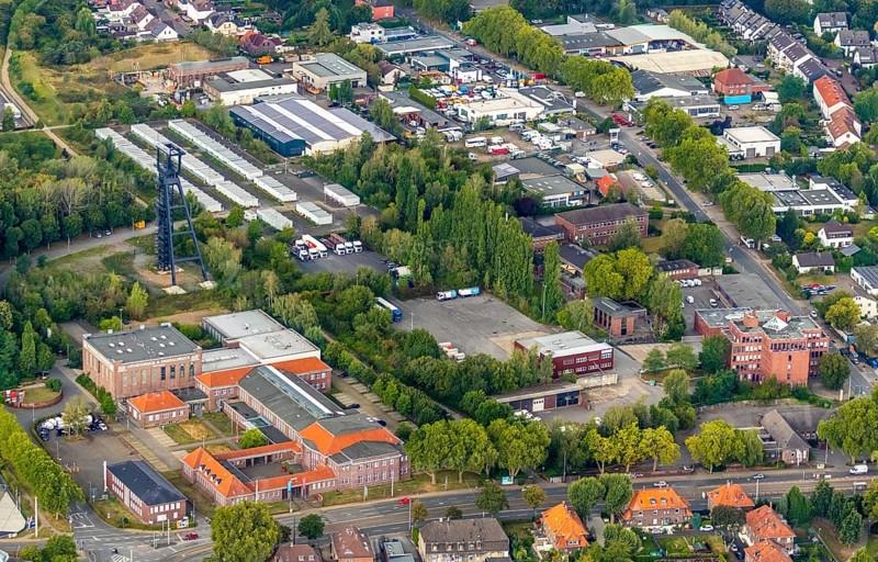 Aerial view, Lohrheidestrasse industrial estate, Wattenscheid technology and start-up centre, refugee accommodation at the former Holland colliery, Leithe, Bochum, Ruhr area, North Rhine-Westphalia, Germany, B & W Druck & Marketing GmbH, Bochum-Wattenscheid, DE, Former Holland colliery, Emil-Weitz-Straße, Europe, refugees, winding tower, commercial enterprises, commercial area, commercial area, commercial park, commercial location, commercial use, industrial area, industrial location, aerial photograph, aerial photography, aerial photography, Lyrenstraße, Plan B Ruhr e.V., Wattenscheid district, technology centre, overview, bird's-eye view, Wattenscheid, residential container, birds-eyes view, overview