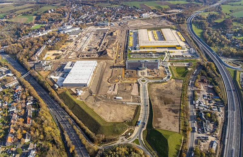 Construction site, new construction DHL Logistik, office address office 51Â°7, office building Goldbeck, former Opel site, former Opel administration building, Laer, Bochum, North Rhine-Westphalia, Germany, expansion areas, construction work, building plots, construction measure, DE, monument protection, earthworks, renewal, development, Europe, commercial enterprises, commercial area, commercial park, commercial location, commercial use, freight traffic, industrial area, industrial building, industrial location, capacity requirements, logistics, logistics service, logistics service provider, logistics provider, logistics centre, aerial view, aerial photograph, aerial photography, aerial photography, MARK 51°7, Mark 51/7, Opelring, Ruhr area, freight forwarding, transport, transport service, overview, bird's-eye view, growth, becoming and growing, birds-eyes view, overview