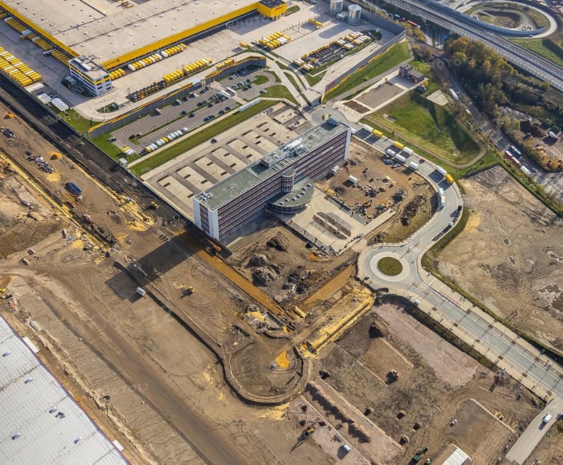 Construction site, new construction DHL Logistik, former Opel site, former Opel administration building, Laer, Bochum, North Rhine-Westphalia, Germany, expansion areas, construction work, building plots, construction measure, DE, monument protection, earthworks, renewal, development, Europe, commercial enterprises, commercial area, commercial park, commercial site, commercial use, freight transport, industrial area, industrial building, industrial site, capacity requirements, logistics, logistics service, logistics service provider, logistics provider, logistics centre, aerial view, aerial photograph, aerial photography, aerial photography, MARK 51°7, Mark 51/7, Opelring, Ruhr area, freight forwarding, transport, transport service, overview, bird's-eye view, growth, becoming and growing, birds-eyes view, overview
