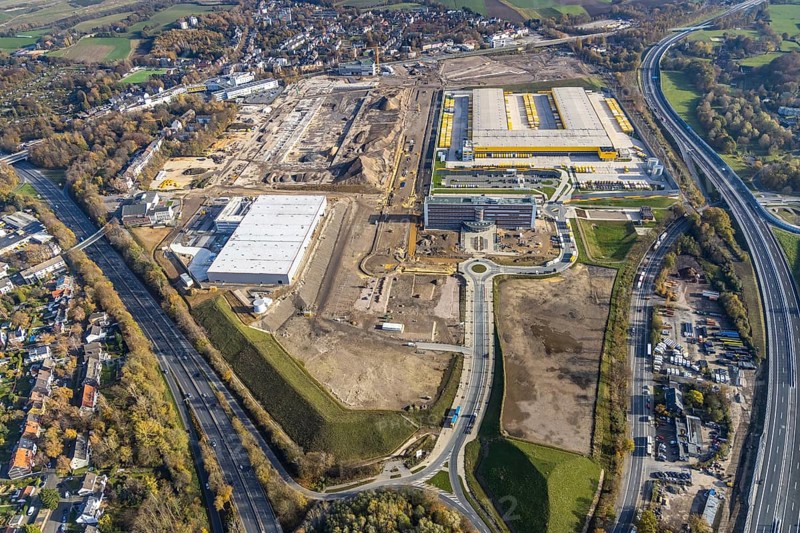 Construction site, new construction DHL Logistik, office address office 51Â°7, office building Goldbeck, former Opel site, former Opel administration building, Laer, Bochum, North Rhine-Westphalia, Germany, expansion areas, construction work, building plots, construction measure, DE, monument protection, earthworks, renewal, development, Europe, commercial enterprises, commercial area, commercial park, commercial location, commercial use, freight traffic, industrial area, industrial building, industrial location, capacity requirements, logistics, logistics service, logistics service provider, logistics provider, logistics centre, aerial view, aerial photograph, aerial photography, aerial photography, MARK 51°7, Mark 51/7, Opelring, Ruhr area, freight forwarding, transport, transport service, overview, bird's-eye view, growth, becoming and growing, birds-eyes view, overview