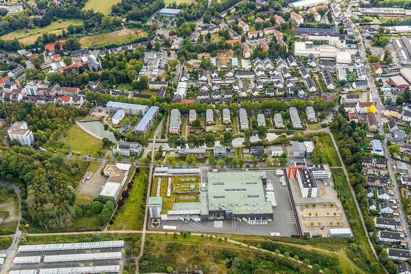 Aerial view, Refugee accommodation at the former Holland colliery, Weststraße retirement home, Weststraße pond housing estate, Leithe, Bochum, Ruhr area, North Rhine-Westphalia, Germany, Retirement home, Care and nursing, Bochum-Wattenscheid, DE, Former Holland colliery, Emil-Weitz-Straße, Europe, refugees, winding tower, commercial enterprises, commercial area, commercial area, commercial location, commercial use, industrial area, industrial location, aerial photograph, aerial photography, aerial photography, care facility, Plan B Ruhr e.V., lake, retirement home, retirement residence, retirement home, retirement centre, Wattenscheid district, pond, overview, bird's-eye view, Wattenscheid, residential container, Zipp Industries Maschinenbau, birds-eyes view, overview