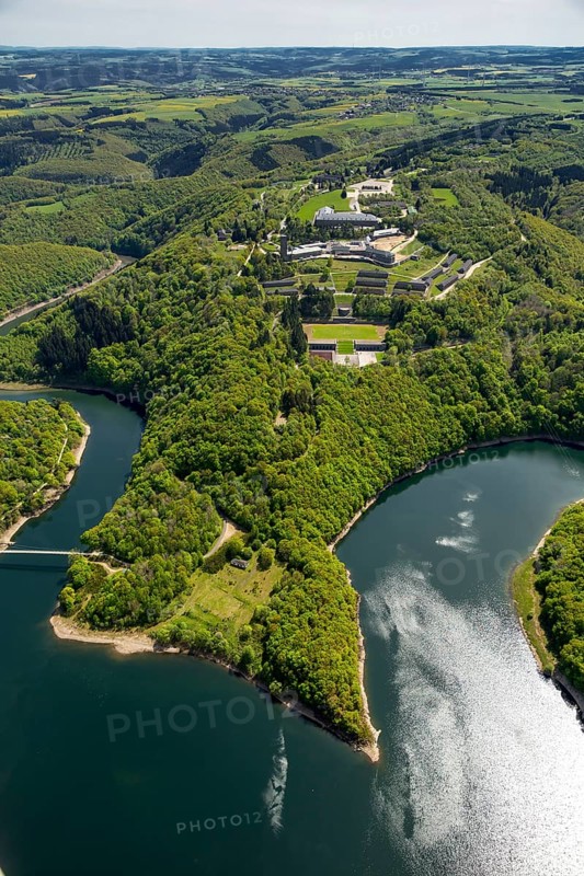 Former Nazi Ordensburg Vogelsang, a building complex erected by the National Socialists on Mount Erpenscheid (1) near Gemünd Eifel above the Urft Dam, Camp Vogelsang former barracks of the Belgian armed forces, Schleiden, Eifel, North Rhine-Westphalia, Germany, Europe, aerial view, birds-eyes view, aerial photography, aerial photography, overview, bird's eye view