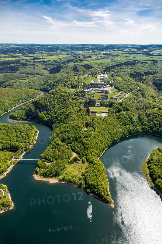 Former Nazi Ordensburg Vogelsang, a building complex erected by the National Socialists on Mount Erpenscheid (1) near Gemünd Eifel above the Urft Dam, Camp Vogelsang former barracks of the Belgian armed forces, Schleiden, Eifel, North Rhine-Westphalia, Germany, Europe, aerial view, birds-eyes view, aerial photography, aerial photography, overview, bird's eye view
