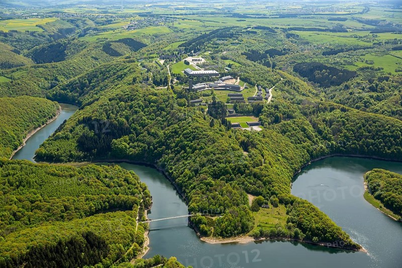 Former Nazi Ordensburg Vogelsang, a building complex erected by the National Socialists on Mount Erpenscheid (1) near Gemünd Eifel above the Urft Dam, Camp Vogelsang former barracks of the Belgian armed forces, Schleiden, Eifel, North Rhine-Westphalia, Germany, Europe, aerial view, birds-eyes view, aerial photography, aerial photography, overview, bird's eye view