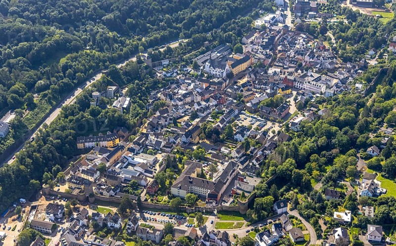 Aerial view, historic old town with St Donatus-Jesuit church and St Michael-Gymnasium as well as the collegiate church of St Chrysanthus and Daria. Chrysanthus and Daria, Bad Münstereifel town hall and Münstereifel Castle with destroyed bank area of the Erft after the Erft flood in Bad Münstereifel, Ahr flood, Ahr valley, North Rhine-Westphalia, Germany, place of worship, Bad Münstereifel, authority, education, educational institution, castle, DE, Europe, flood disaster, religious community, place of worship, property tax, grammar school, hillside castle, sacred site, flood disaster, real estate, flood of the century, church, parish, denomination, educational institute, aerial photograph, aerial photography, aerial photography, town hall, religion, religious site, ruin, school, heavy rain, overview, bird's-eye view, living and life, residential area, residential buildings, quality of life, birds-eyes view, overview, flooding
