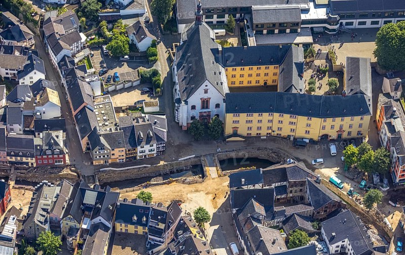 Aerial view, Historic old town with St. Donatus Jesuit Church and St. Michael-Gymnasium and destroyed bank area of the Erft after the Erft flood in Bad Münstereifel, Ahr flood, Ahr valley, North Rhine-Westphalia, Germany, place of worship, Bad Münstereifel, education, educational institution, DE, Europe, flood disaster, religious community, place of worship, property tax, grammar school, holy place, flood disaster, real estate, flood of the century, church, parish, denomination, educational institute, aerial photograph, aerial photography, aerial photography, religion, religious site, school, heavy rain, overview, bird's-eye view, living and life, residential area, residential buildings, quality of life, birds-eyes view, overview, flooding