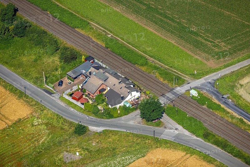 Aerial view, residential house at Wickeder Straße level crossing, Wimbern, Wickede, Sauerland, North Rhine-Westphalia, Germany, railway tracks, level crossing, DE, Europe, aerial view, aerial photography, aerial photography, overview, bird's-eye view, overview