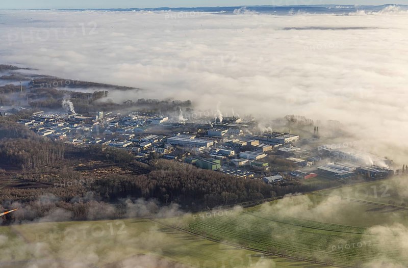Aerial view, industrial area Westerhaar in fog and mountains of the Sauerland in backlight in Wickede, Sauerland, North Rhine-Westphalia, Germany, mountains, DE, Europe, shapes and colours, backlight, commercial enterprises, commercial area, commercial area, commercial location, commercial use, high-rise building, industrial area, industrial site, aerial view, aerial photography, aerial photography, fog, overview, bird's-eye view, WEA, Wickede, wind energy, wind energy plant, wind power, wind turbine, wind turbines, clouds, birds-eyes view, overview