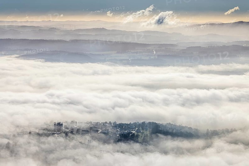 Aerial view, residential area in fog with high-rise building, mobile phone antennas in backlight in Wickede, Sauerland, North Rhine-Westphalia, Germany, mountains, DE, Europe, shapes and colours, backlight, high-rise building, aerial view, aerial photography, aerial photography, fog, overview, bird's-eye view, WEA, Wickede, wind energy, wind energy plant, wind power, wind turbine, wind turbines, clouds, birds-eyes view, overview