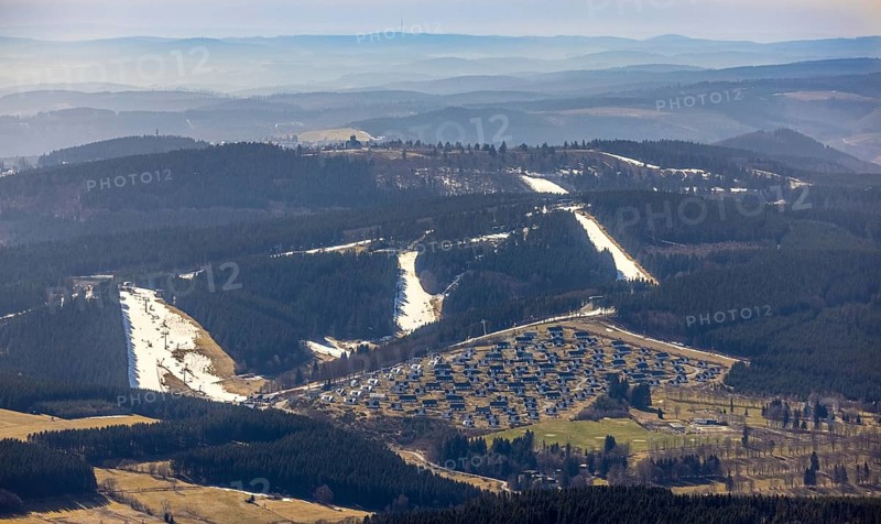 Landal Ferienpark Winterberg, Winterberg, Sauerland, North Rhine-Westphalia, Germany, DE, Europe, distant view, hilly landscape, aerial view, aerial photograph, aerial photography, aerial photography, pandemic lockdown, terraced houses, snow remains, overview, bird's eye view, forest area, winter, residential complex, residential park, housing estate, birds-eyes view, overview