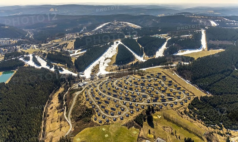 Landal Ferienpark Winterberg, Winterberg, Sauerland, North Rhine-Westphalia, Germany, DE, Europe, distant view, hilly landscape, aerial view, aerial photograph, aerial photography, aerial photography, pandemic lockdown, terraced houses, snow remains, overview, bird's eye view, forest area, winter, residential complex, residential park, housing estate, birds-eyes view, overview