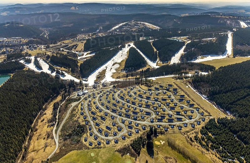 Landal Ferienpark Winterberg, Winterberg, Sauerland, North Rhine-Westphalia, Germany, DE, Europe, distant view, hilly landscape, aerial view, aerial photograph, aerial photography, aerial photography, pandemic lockdown, terraced houses, snow remains, overview, bird's eye view, forest area, winter, residential complex, residential park, housing estate, birds-eyes view, overview