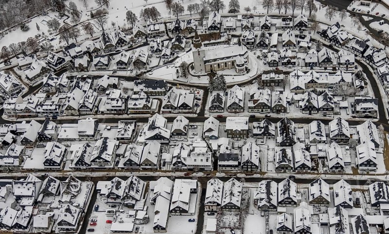 Aerial view of the snowy winter landscape of Winterberg with deserted streets during the Corona lockdown with the Catholic Church Winterberg in Sauerland in North Rhine-Westphalia, Germany, Sauerland, Europe, aerial photo, birds-eyes view, aerial photography, aerial photography, overview, bird's eye view, lockdown, closed winter landscape, corona lockdown, deserted, snow, winter weather, corona-related lockdown