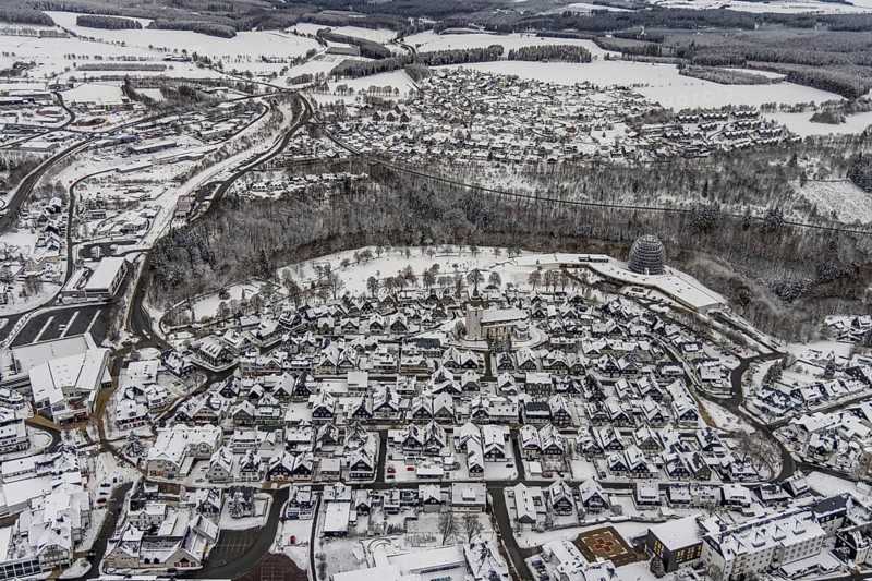 Aerial view of the snowy winter landscape of Winterberg with deserted streets during the Corona lockdown with the Catholic Church Winterberg in Sauerland in North Rhine-Westphalia, Germany, Sauerland, Europe, aerial photo, birds-eyes view, aerial photography, aerial photography, overview, bird's eye view, lockdown, closed winter landscape, corona lockdown, deserted, snow, winter weather, corona-related lockdown