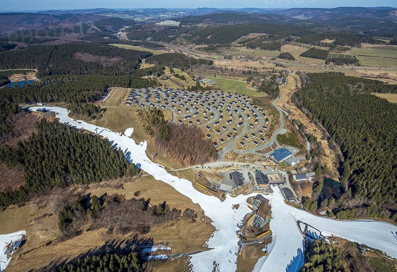 Landal Ferienpark Winterberg, Winterberg, Sauerland, North Rhine-Westphalia, Germany, DE, Europe, distant view, hilly landscape, aerial view, aerial photograph, aerial photography, aerial photography, pandemic lockdown, terraced houses, snow remains, overview, bird's eye view, forest area, winter, residential complex, residential park, housing estate, birds-eyes view, overview