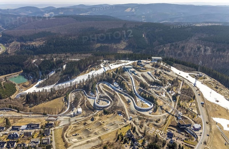 Veltins EisArena luge track and bobsleigh run, Winterberg, Sauerland, North Rhine-Westphalia, Germany, bobsleigh, DE, Europe, artificial ice rink, aerial view, aerial photography, aerial photography, pandemic lockdown, luge, snow remains, overview, bird's eye view, forest area, winter, birds-eyes view, overview