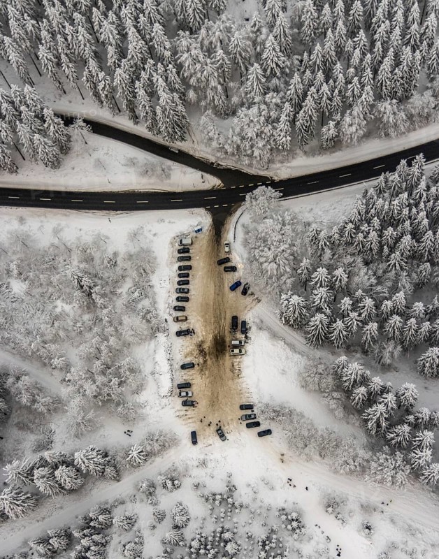 Aerial view of the snowy winter landscape of Winterberg with car park Helleplatz at Kahlen Asten in Sauerland in North Rhine-Westphalia, Germany, Sauerland, Europe, aerial view, birds-eyes view, aerial photography, aerial photography, overview, bird's eye view, lockdown, closed winter landscape, corona lockdown, deserted, snow, winter weather, corona-related lockdown