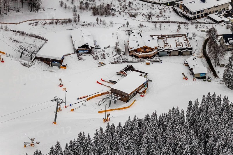 Aerial view of the snowy winter landscape of Winterberg with deserted ski lifts and slopes during the corona-related lockdown in Sauerland in North Rhine-Westphalia, Germany, Sauerland, Europe, aerial photo, birds-eyes view, aerial photography, aerial photography, overview, bird's eye view, lockdown, closed winter landscape, corona lockdown, deserted, snow, winter weather, corona-related lockdown