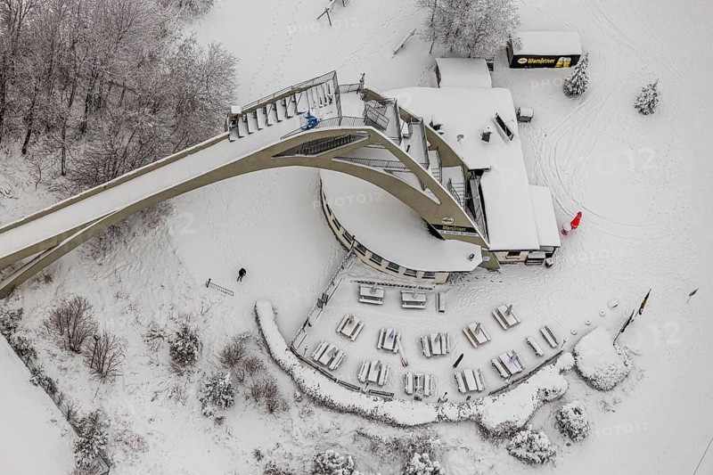 Aerial view of the snowy winter landscape of Winterberg with the St. Georg ski jump in the Sauerland in North Rhine-Westphalia, Germany, Sauerland, Europe, aerial photo, birds-eyes view, aerial photography, aerial photography, overview, bird's eye view, lockdown, closed winter landscape, corona lockdown, deserted, snow, winter weather, corona-related lockdown