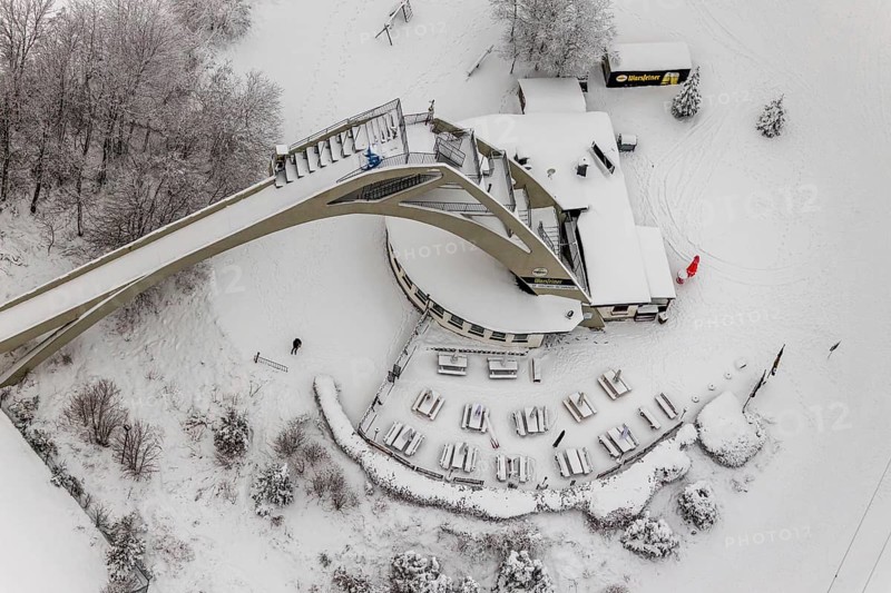 Aerial view of the snowy winter landscape of Winterberg with the St. Georg ski jump in the Sauerland in North Rhine-Westphalia, Germany, Sauerland, Europe, aerial photo, birds-eyes view, aerial photography, aerial photography, overview, bird's eye view, lockdown, closed winter landscape, corona lockdown, deserted, snow, winter weather, corona-related lockdown