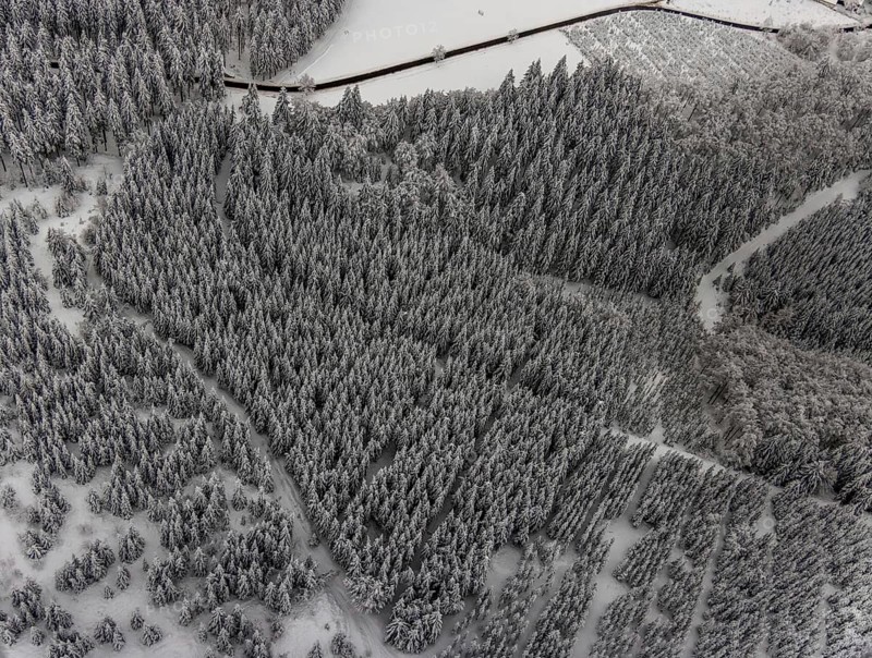 Aerial view of the snowy winter landscape of Winterberg with winding roads and paths in the Sauerland in North Rhine-Westphalia, Germany, Sauerland, Europe, aerial photo, birds-eyes view, aerial photography, aerial photography, overview, bird's eye view, lockdown, closed winter landscape, corona lockdown, deserted, snow, winter weather, corona-related lockdown