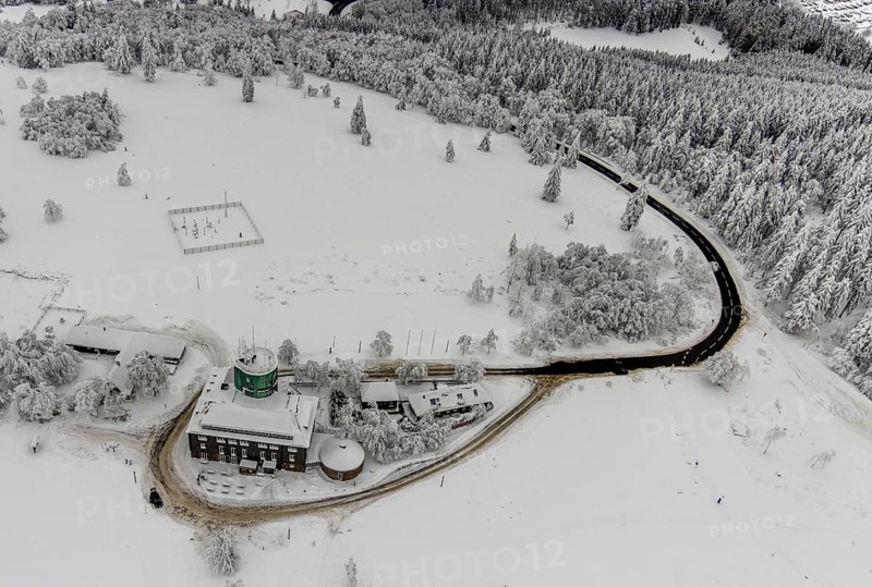 Aerial view of the snowy winter landscape of Winterberg am Kahlen Asten with Astenturm during Corona times in Sauerland in North Rhine-Westphalia, Germany, Sauerland, Europe, aerial view, birds-eyes view, aerial photography, aerial photography, overview, bird's eye view, lockdown, closed winter landscape, corona lockdown, deserted, snow, winter weather, corona-related lockdown, high heath in winter