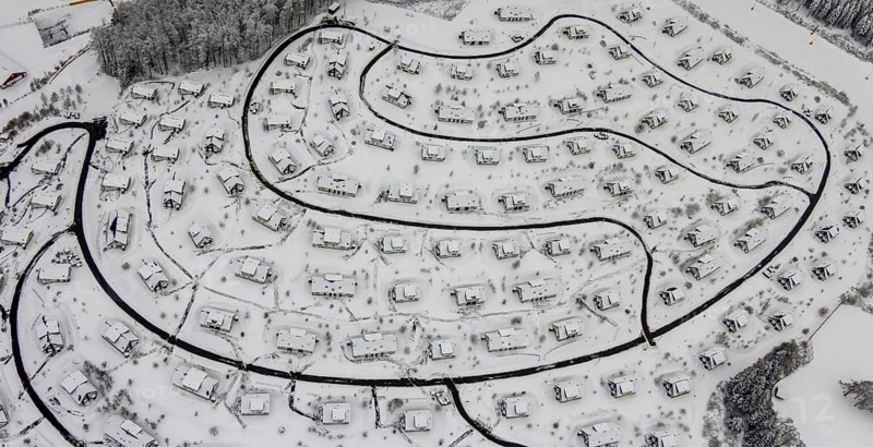 Aerial view of the snowy winter landscape of Winterberg with the deserted Landal Winterberg holiday resort in the Corona Lockdown in Sauerland in North Rhine-Westphalia, Germany, Sauerland, Europe, aerial photo, birds-eyes view, aerial photography, aerial photography, overview, bird's eye view, lockdown, closed winter landscape, corona lockdown, deserted, snow, winter weather, corona-related lockdown