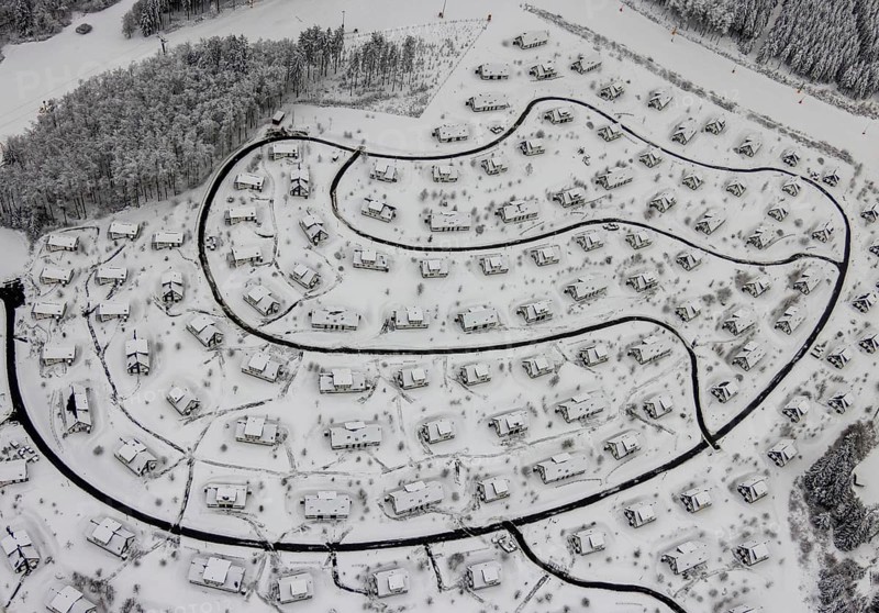 Aerial view of the snowy winter landscape of Winterberg with the deserted Landal Winterberg holiday resort in the Corona Lockdown in Sauerland in North Rhine-Westphalia, Germany, Sauerland, Europe, aerial photo, birds-eyes view, aerial photography, aerial photography, overview, bird's eye view, lockdown, closed winter landscape, corona lockdown, deserted, snow, winter weather, corona-related lockdown