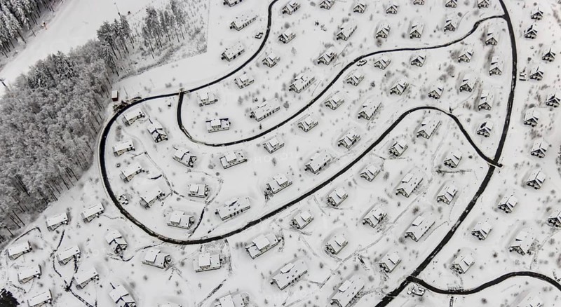 Aerial view of the snowy winter landscape of Winterberg with the deserted Landal Winterberg holiday resort in the Corona Lockdown in Sauerland in North Rhine-Westphalia, Germany, Sauerland, Europe, aerial photo, birds-eyes view, aerial photography, aerial photography, overview, bird's eye view, lockdown, closed winter landscape, corona lockdown, deserted, snow, winter weather, corona-related lockdown