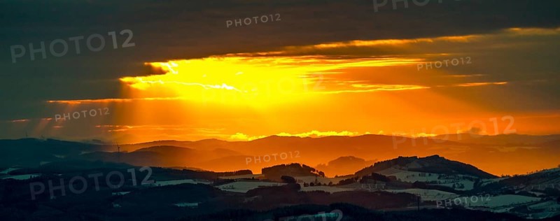 Aerial view of the sunset with a view over the snowy winter landscape from Winterberg to the Bergisches Land in Sauerland in North Rhine-Westphalia, Germany, Sauerland, Europe, aerial view, birds-eyes view, aerial photography, aerial photography, overview, bird's eye view, lockdown, closed winter landscape, corona lockdown, deserted, snow, winter weather, corona-related lockdown