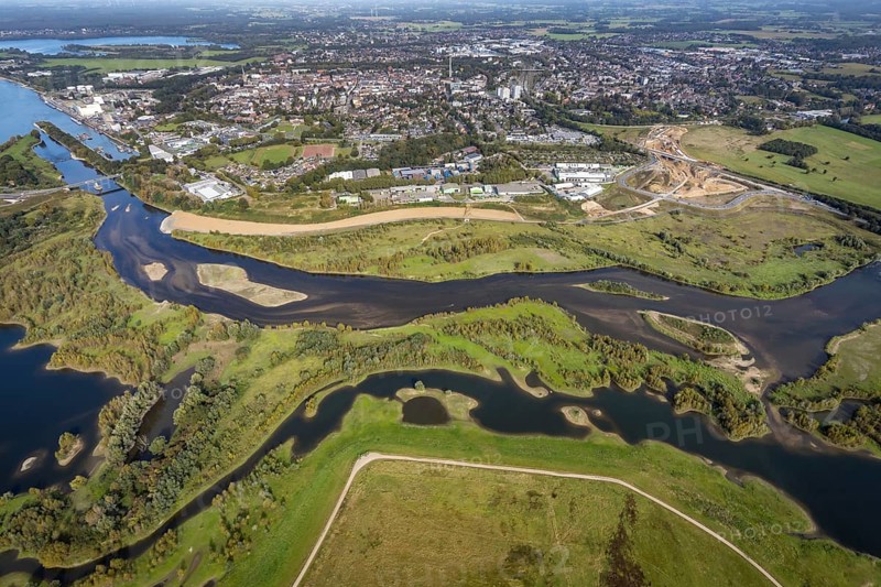 Aerial view, renaturalisation of the Lippe estuary area between Lippeschlösschen and Rhine bridge and Rhine river as well as Rhine-Lippe harbour and construction site of the southern bypass in Wesel, Lower Rhine, North Rhine-Westphalia, Germany, construction work, construction area, construction site, building plots, construction project, construction project, construction site, DE, Europe, Lippe floodplain, Lippeverband, aerial view, aerial photography, aerial photography, new construction, overview, redesign of the Lippe estuary, bird's-eye view, Wesel, birds-eyes view, overview, B58 new, Wesel southern bypass, new road construction, new Lippe estuary