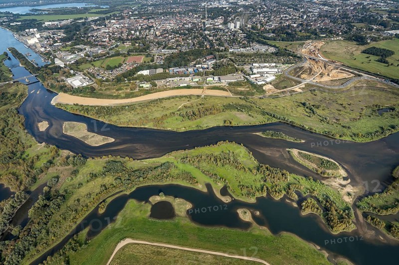 Aerial view, renaturalisation of the Lippe estuary area between Lippeschlösschen and Rhine bridge and Rhine river as well as Rhine-Lippe harbour and construction site of the southern bypass in Wesel, Lower Rhine, North Rhine-Westphalia, Germany, construction work, construction area, construction site, building plots, construction project, construction project, construction site, DE, Europe, Lippe floodplain, Lippeverband, aerial view, aerial photography, aerial photography, new construction, overview, redesign of the Lippe estuary, bird's-eye view, Wesel, birds-eyes view, overview, B58 new, Wesel southern bypass, new road construction, new Lippe estuary