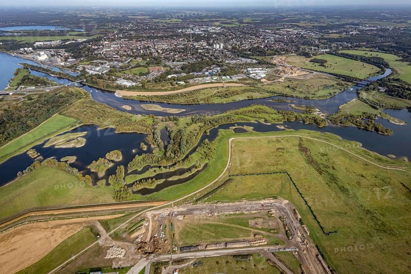 Aerial view, renaturalisation of the Lippe estuary area between Lippeschlösschen and Rhine bridge and Rhine river as well as Rhine-Lippe harbour and construction site of the southern bypass in Wesel, Lower Rhine, North Rhine-Westphalia, Germany, construction work, construction area, construction site, building plots, construction project, construction project, construction site, DE, Europe, Lippe floodplain, Lippeverband, aerial view, aerial photography, aerial photography, new construction, overview, redesign of the Lippe estuary, bird's-eye view, Wesel, birds-eyes view, overview, B58 new, Wesel southern bypass, new road construction, new Lippe estuary