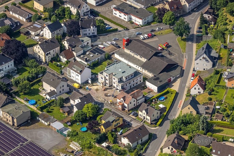 Aerial photo, Wickede Volunteer Fire Brigade, construction site, new residential building on Neue Straße, Wickede, Sauerland, North Rhine-Westphalia, Germany, construction work, construction area, building site, building plots, construction project, construction site, fire fighters, fire protection, fire station, DE, Europe, fire station, fire brigade, property tax, real estate, aerial view, aerial photography, aerial photography, new building, La rue nouvelle project, rescue station, overview, bird's-eye view, residential complex, living and life, residential area, residential buildings, birds-eyes view, overview