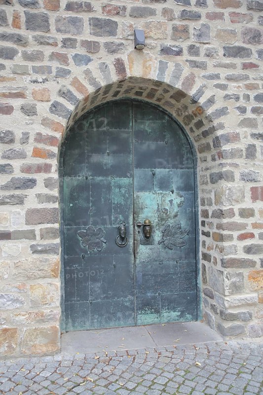 Door and entrance to the art museum with door handle by Heinrich Apel 1974, bronze sculptures, modern art decorations, metal door, Kloster Unser Lieben Frauen, Magdeburg, Romanesque Road, Saxony-Anhalt, Germany