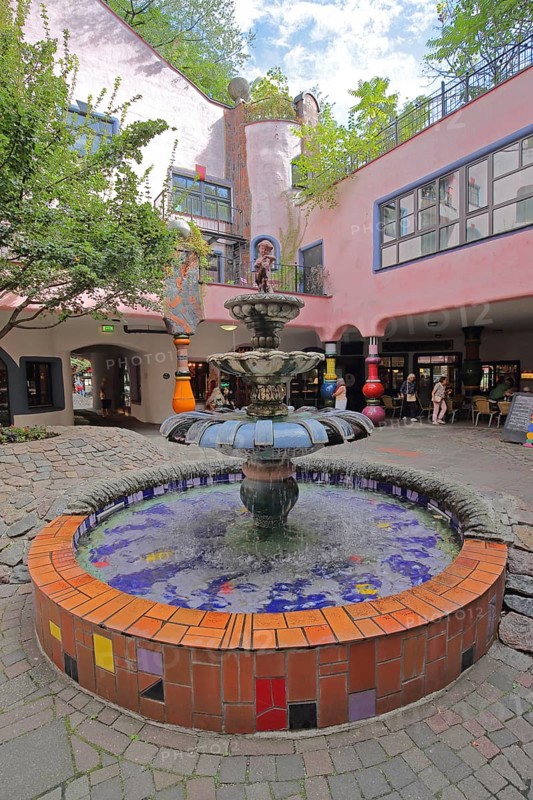 Fountain in the inner courtyard, Green Citadel, Hundertwasser House, mosaic, Magdeburg, Saxony-Anhalt, Germany
