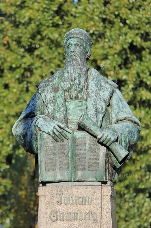 Monument to Johannes Gutenberg with book and scroll, bronze sculpture, inscription, Gutenberg monument, Magdeburg, Saxony-Anhalt, Germany
