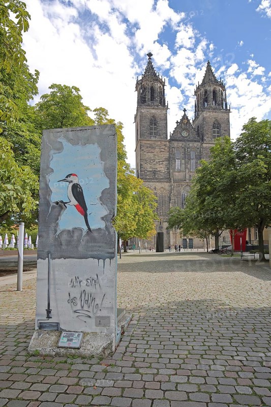 Gothic cathedral and part of the Berlin Wall, memorial, monument, We are the people, political appeal, inner-German border, GDR, democratic, separation, division, great spotted woodpecker as a symbol of demolition, destruction, fragment, bird figure, St Mauritius and St Katharina, Magdeburg Cathedral, Magdeburg, Saxony-Anhalt, Germany