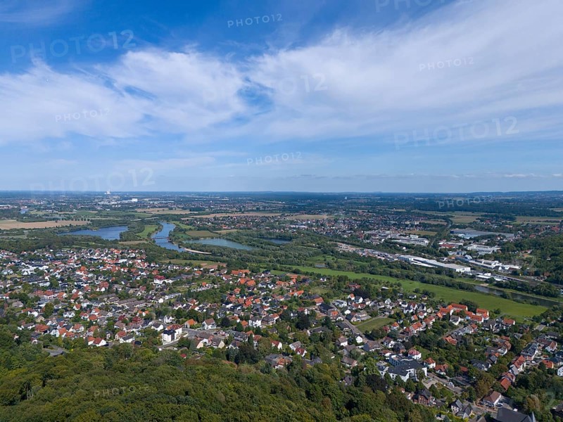 View of a town with river and green landscape under a blue sky with clouds, aerial view from the Kaiser Wilhelm monument at Porta Westfalica, Barkhausen, East Westphalia-Lippe, North Rhine-Westphalia, Germany