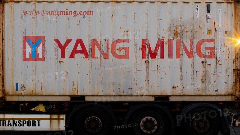 Photograph of a heavily loaded container standing on a trailer, Garbsen, Hanover Lower Saxony, Germany